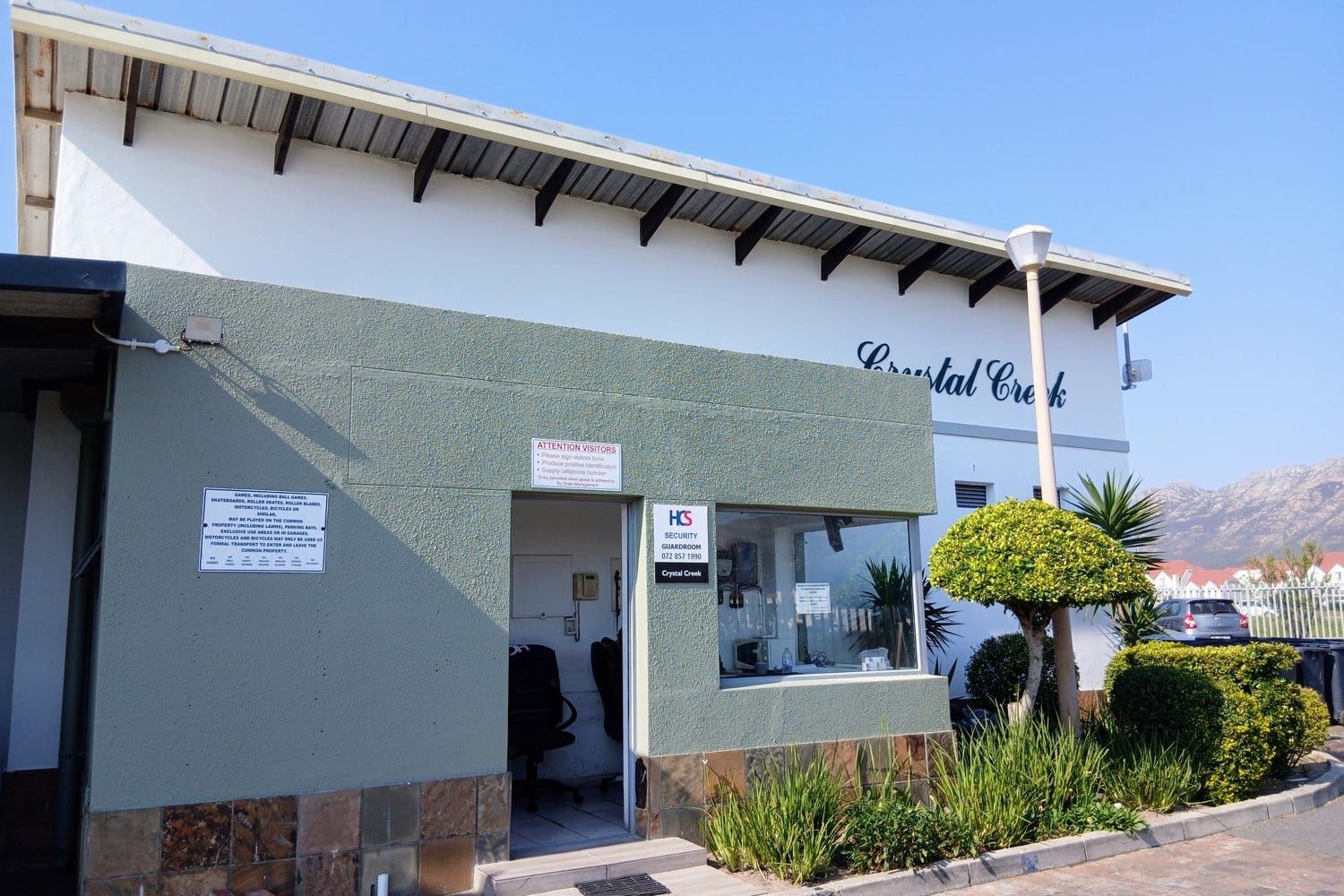 The same Gordon's Bay guardhouse finished in white with the lower walls in green
