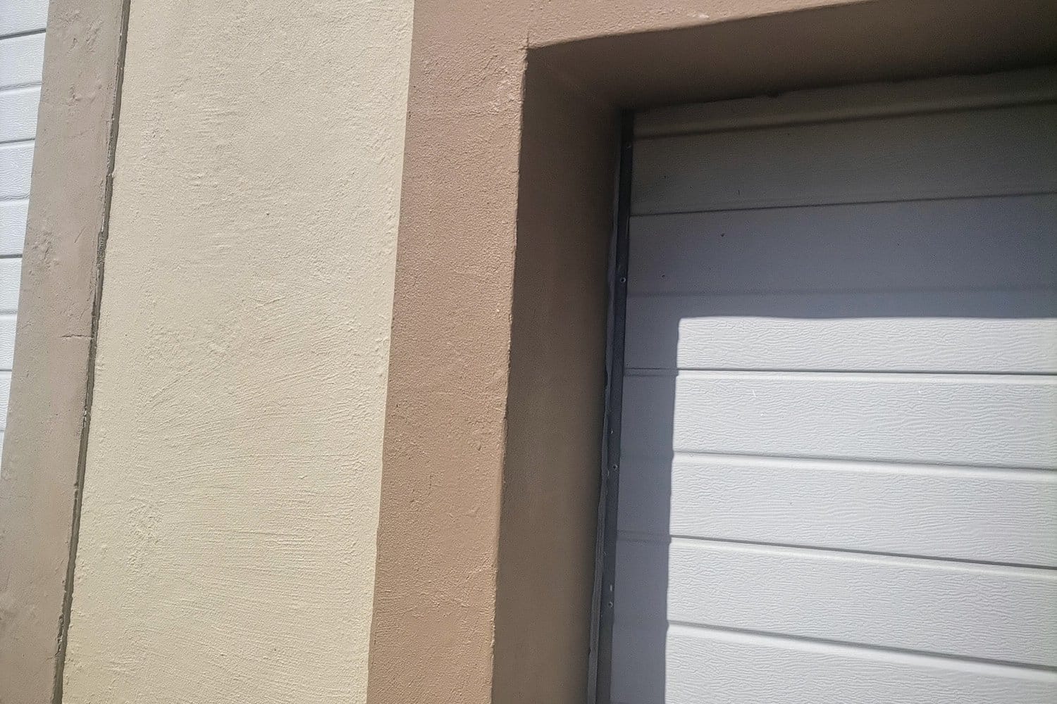 The same Somerset West pillar filled, sanded, primed and painted beside the garage door