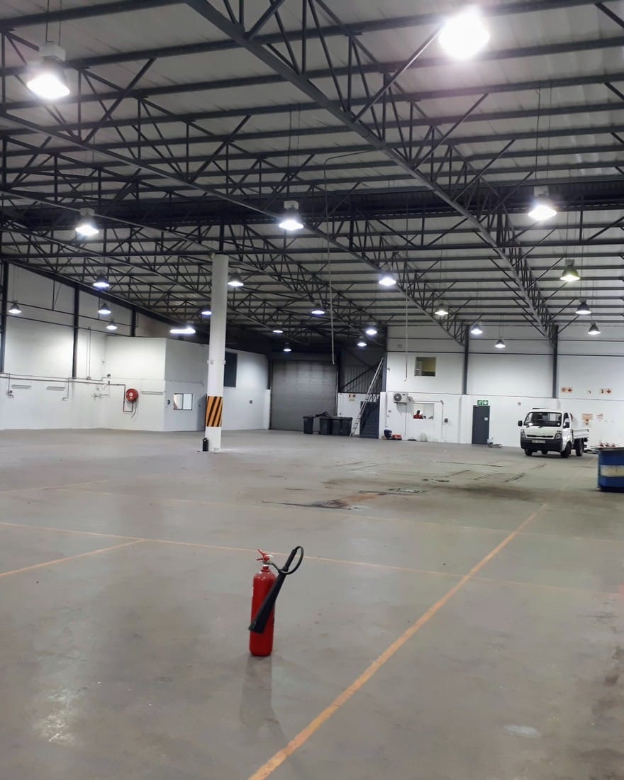 Interior of a large finished commercial warehouse, clean and in use