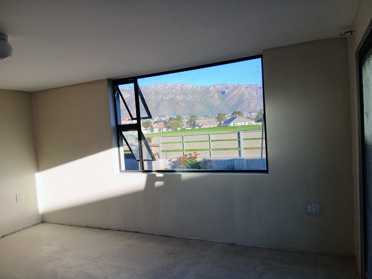 Finished new-build room in Gordon's Bay, with the mountain visible through the window