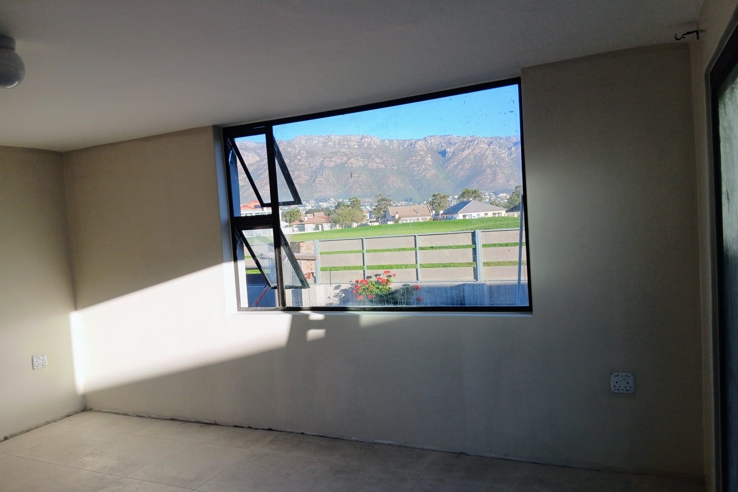 The same Gordon's Bay room with walls and ceiling finished and the floor tiled