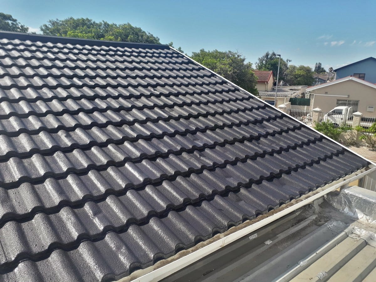 Tile roof in Milnerton after cleaning and two coats of dark roof paint